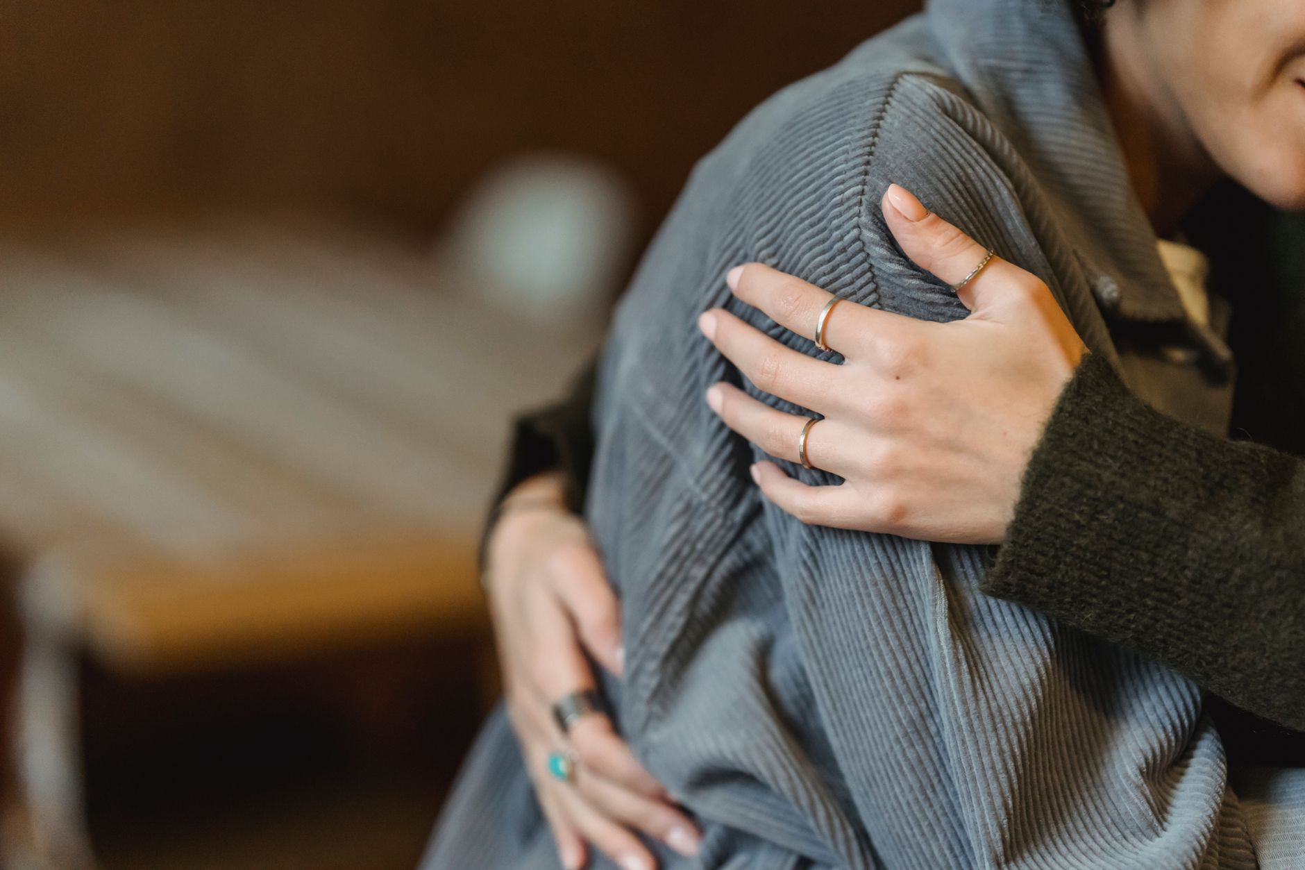 A gentle, reassuring embrace between two people
